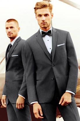 Groom and best man dressed in tuxedos