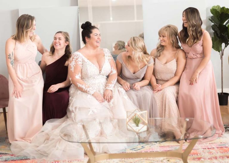 Image of bride and bridesmaids laughing