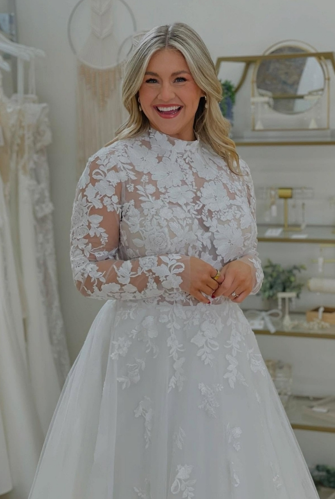 bride to be in stunning long sleeve bridal gown at twirl bride wedding dress shop in chillicothe oh