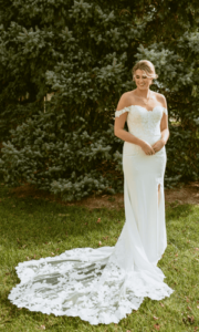 A beautiful bride in sheath wedding dress in the garden.