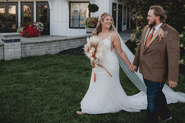A bride and a groom with coordinating wedding looks