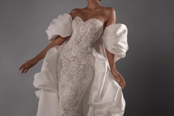 A bride wearing a sparkling wedding dress with sweetheart neckline